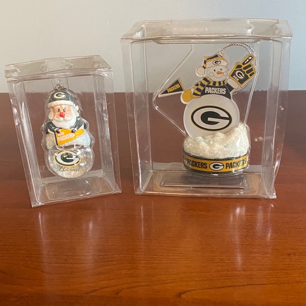 Green Bay Packers ornaments. New in packaging.